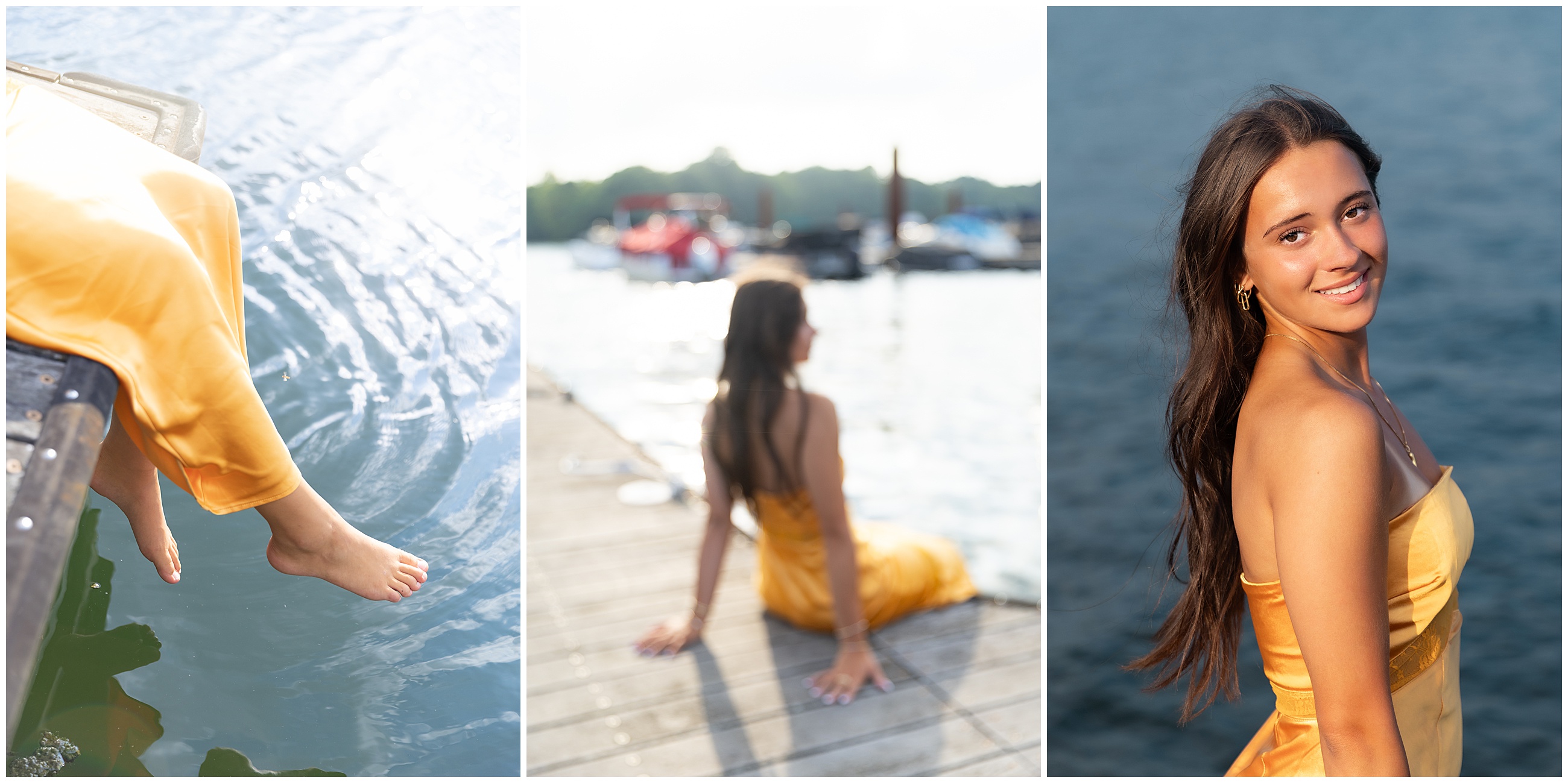 Woman in yellow dress by the water on a dock. She dangles feet over the edge, sits facing blurred boats, smiles at the camera for a high school senior portrait session.
