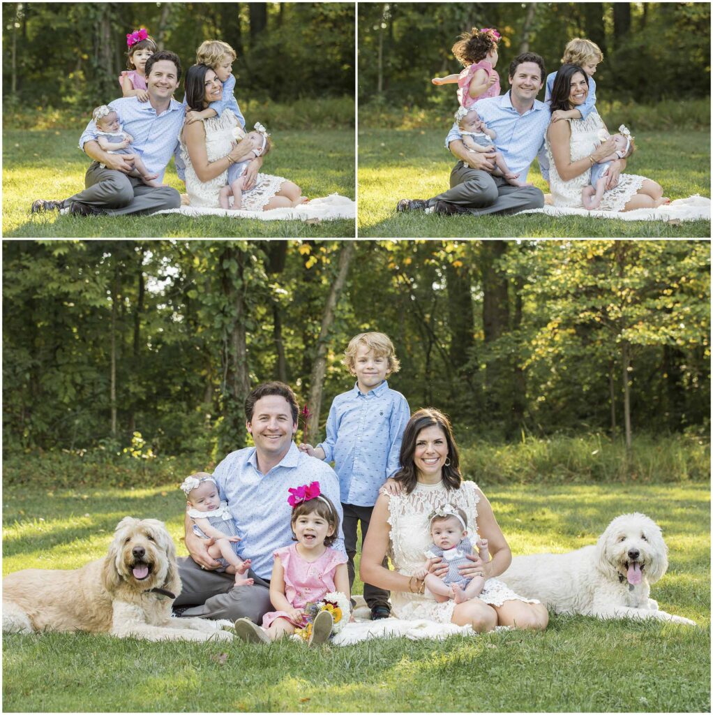 Husband and wife family photo on a picnic blank with dogs and young children in Columbus Ohio park