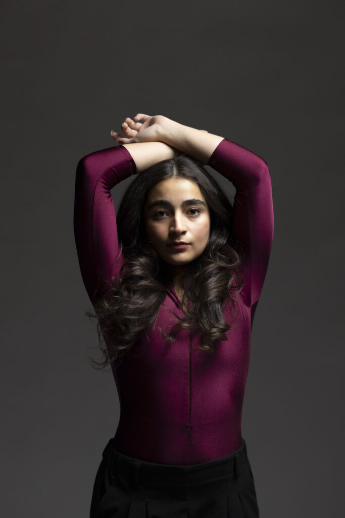 Dancer with hands up